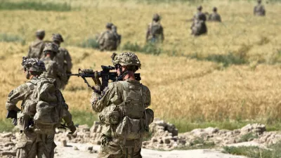 Paul Brown, a U.S. Army Staff Sergeant of the Charlie company from 5-20 infantry Regiment attached to 82nd Airborne Division, aims his rifle during a mission outside Payandi village in Zharay district of Kandahar province, southern Afghanistan June 6, 2012. REUTERS/Shamil Zhumatov (AFGHANISTAN - Tags: MILITARY CIVIL UNREST)