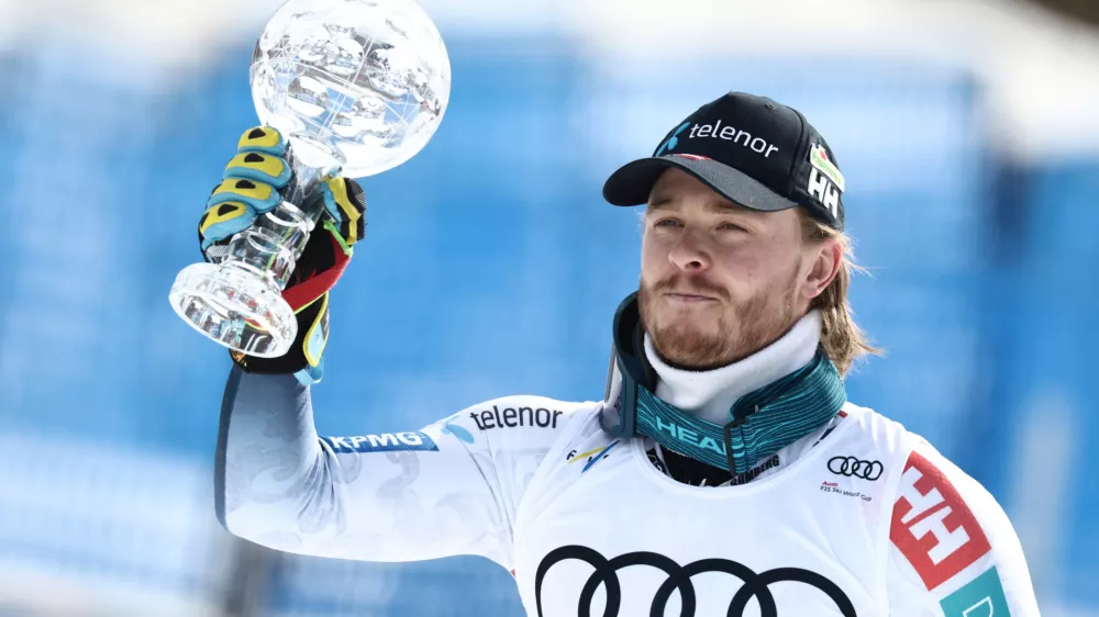 Norway's Atle Lie McGrath holds the globe trophy for the alpine ski, men's slalom discipline, at the Lillehammer World Cup Finals, in Hafjell, Norway, Wednesday, March 25, 2026. (AP Photo/Gabriele Facciotti)