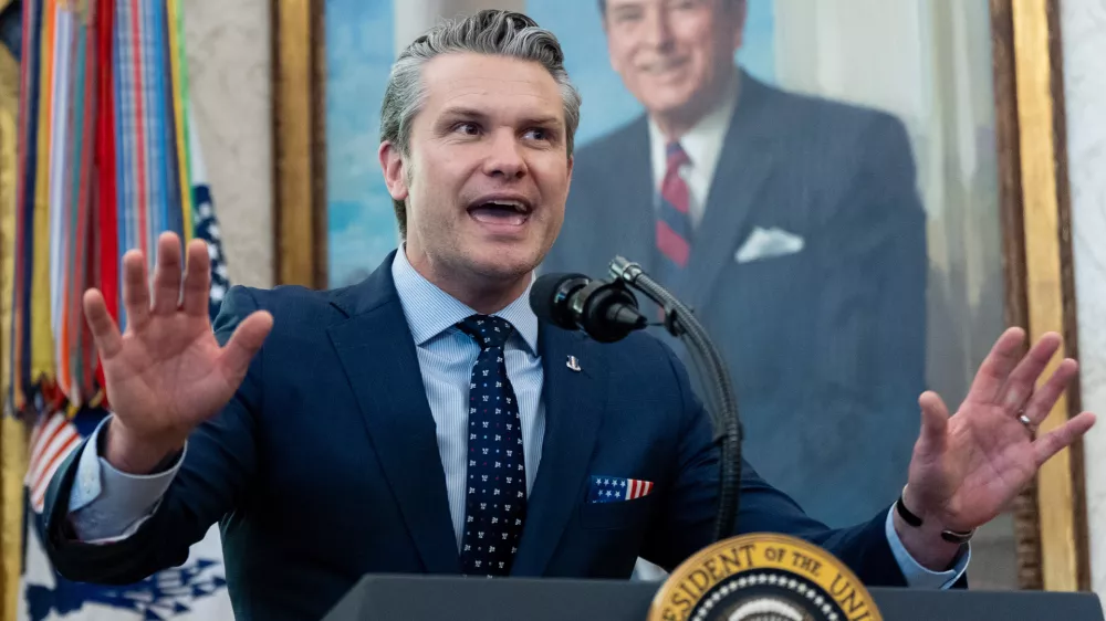 Defense Secretary Pete Hegseth speaks during the swearing-in for Homeland Security Secretary Markwayne Mullin in the Oval Office of the White House, Tuesday, March 24, 2026, in Washington. (AP Photo/Alex Brandon)