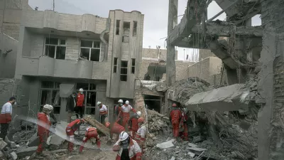 FILE - First responders inspect the remains of a residential building hit in an overnight strike during the U.S.-Israeli military campaign in Tabriz, Iran, March 24, 2026. (AP Photo/Matin Hashemi, File)