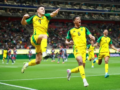 Soccer Football - FIFA World Cup - Inter-Confederation Playoffs - Semi Final - New Caledonia v Jamaica - Estadio Guadalajara, Guadalajara, Mexico - March 26, 2026 Jamaica's Bailey-Tye Cadamarteri celebrates scoring their first goal with Richard King REUTERS/Eloisa Sanchez   TPX IMAGES OF THE DAY
