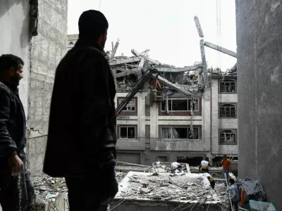 A man looks at a residential building damaged by a strike, amid the U.S.-Israeli conflict with Iran, in Tehran, Iran, March 27, 2026. Majid Asgaripour/WANA (West Asia News Agency) via REUTERS ATTENTION EDITORS - THIS PICTURE WAS PROVIDED BY A THIRD PARTY   TPX IMAGES OF THE DAY