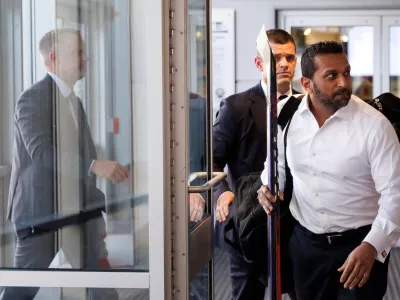FBI Director Kash Patel walks to the locker room ahead of the annual lawmakers vs. lobbyist Congressional Hockey Challenge charity hockey game at MedStar Capitals Iceplex on Thursday, March 26, 2026, in Arlington, Va. (AP Photo/Tom Brenner)