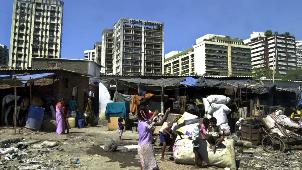 Children play in a slum in Bombay, India, Wednesday, Feb. 2, 2005. 80,000 shanties have been demolished since Dec. 7 across India's financial capital, part of an ambitious 370 billion rupee (US$8.2 billion; euro6.3 billion) urban renewal plan for broader roads, new rail lines and bigger bridges. Officials say the shanties blocked the new projects, but activists say some 350,000 slum dwellers are now homeless. 54 percent of Bombay's estimated 15 million people live in slums along railway tracks, on sidewalks, in parks or encroachments on government land. (AP Photo/Rajesh Nirgude)