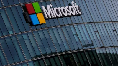 FILE PHOTO: A view shows a Microsoft logo at Microsoft offices in Issy-les-Moulineaux near Paris, France, March 21, 2025. REUTERS/Gonzalo Fuentes/File Photo