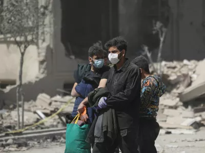 People walk in a residential neighbourhood damaged by a strike, amid the U.S.-Israeli conflict with Iran, in Tehran, Iran, March 30, 2026. Majid Asgaripour/WANA (West Asia News Agency) via REUTERS ATTENTION EDITORS - THIS PICTURE WAS PROVIDED BY A THIRD PARTY