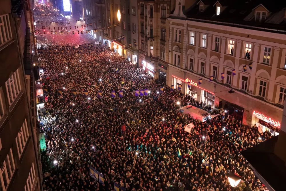 An aerial view shows fans celebrating after the Bosnian national team qualified for the World Cup by winning a penalty shootout against Italy, in Sarajevo, Bosnia, Wednesday, April 1, 2026. (AP Photo/Armin Durgut)