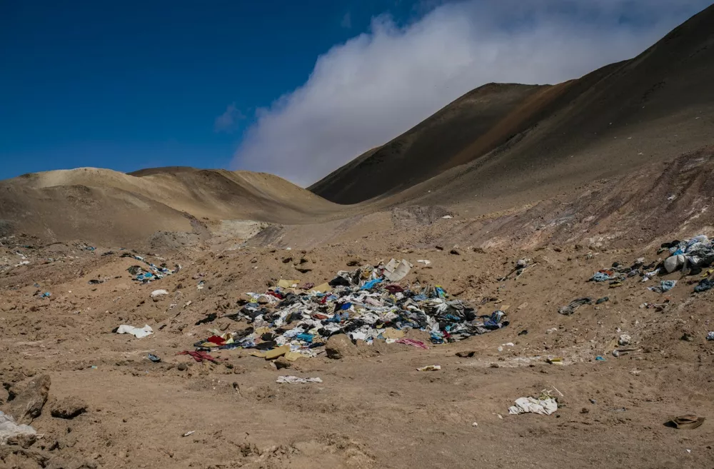 Handout picture released by Chile's Primer Tribunal Ambiental (First Environmental Tribunal) showing an illegal dump of used clothes discarded in the Atacama desert, in Alto Hospicio, Iquique, northern Chile, on August 2, 2022. The Chilean justice system is investigating the huge used clothing dump located in the Atacama desert, for environmental damage, the First Environmental Tribunal reported on August 3, 2022. The tons of textile waste and other items such as tyres, car parts and electronics, that have been dumped in the Alto Hospicio area can now be seen partially burned and buried.,Image: 711770242, License: Rights-managed, Restrictions: RESTRICTED TO EDITORIAL USE - MANDATORY CREDIT "AFP PHOTO / PRIMER TRIBUNAL AMBIENTAL" - NO MARKETING - NO ADVERTISING CAMPAIGNS - DISTRIBUTED AS A SERVICE TO CLIENTS, ***HANDOUT image or SOCIAL MEDIA IMAGE or FILMSTILL for EDITORIAL USE ONLY! * Please note: Fees charged by Profimedia are for the Profimedia's services only, and do not, nor are they intended to, convey to the user any ownership of Copyright or License in the material. Profimedia does not claim any ownership including but not limited to Copyright or License in the attached material. By publishing this material you (the user) expressly agree to indemnify and to hold Profimedia and its directors, shareholders and employees harmless from any loss, claims, damages, demands, expenses (including legal fees), or any causes of action or allegation against Profimedia arising out of or connected in any way with publication of the material. Profimedia does not claim any copyright or license in the attached materials. Any downloading fees charged by Profimedia are for Profimedia's services only. * Handling Fee Only ***, Model Release: no