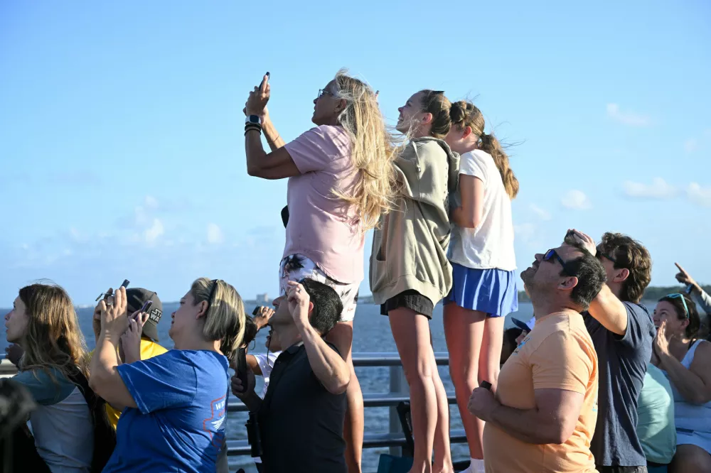 Spectators view NASA's Artemis II moon rocket launch from the A. Max Brewer Bridge, Wednesday, April 1, 2026, in Titusville, Fla. (AP Photo/Phelan M. Ebenhack)