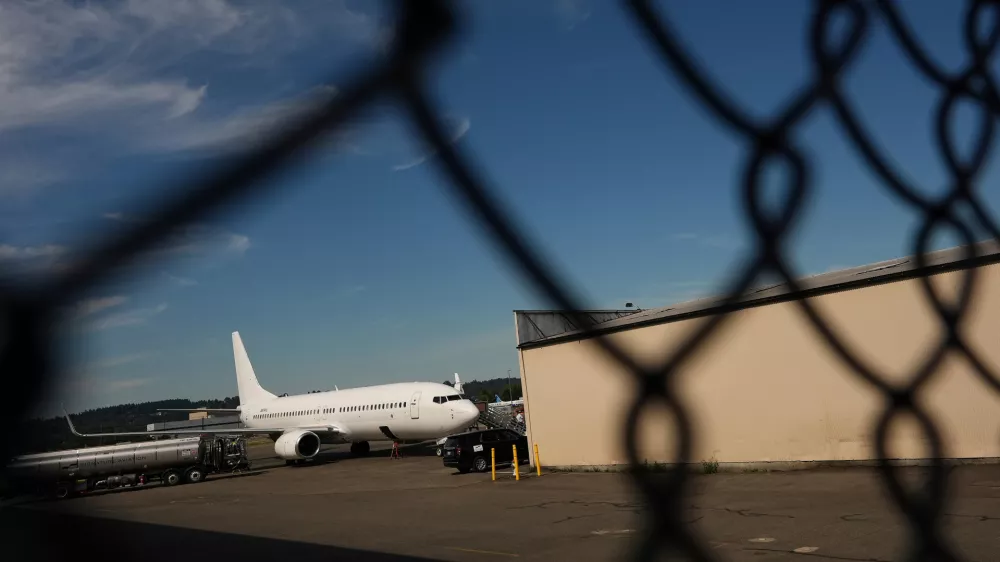 FILE - A U.S. Immigration and Customs Enforcement flight operates out of King County International Airport-Boeing Field, Aug. 23, 2025, in Seattle. (AP Photo/Lindsey Wasson, File)