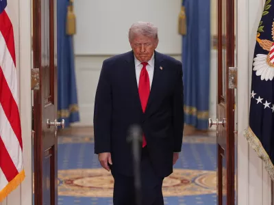 President Donald Trump arrives to speak about the Iran war from the Cross Hall of the White House on Wednesday, April 1, 2026, in Washington. (AP Photo/Alex Brandon, Pool)