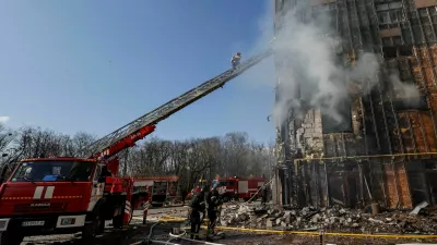 Firefighters work at the scene of an apartment building hit by a Russian drone strike, amid Russia's attack on Ukraine, in Kharkiv, Ukraine, April 2, 2026. REUTERS/Sofiia Gatilova