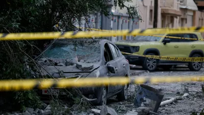 A wrecked car near damaged buildings at the site of an impact of what Bahrain's Ministry of Interior (MOI) said was falling debris of an intercepted Iranian drone last night, amid the U.S.-Israeli conflict with Iran, in Sitra, Bahrain, April 4, 2026. REUTERS/Hamad I Mohammed   TPX IMAGES OF THE DAY