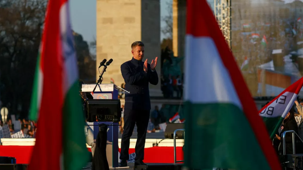 FILE PHOTO: Peter Magyar, leader of the opposition Tisza party, claps on stage during Hungary's National Day celebrations, which also commemorates the 1848 Hungarian Revolution against Habsburg rule, in Budapest, Hungary, March 15, 2026. REUTERS/Bernadett Szabo/File Photo