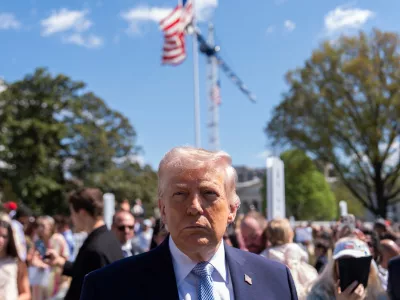 President Donald Trump speaks with reporters during the White House Easter Egg Roll on the South Lawn of the White House, Monday, April 6, 2026, in Washington. (AP Photo/Julia Demaree Nikhinson)