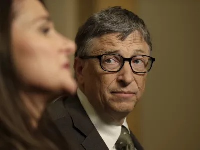 Bill Gates listens to his wife Melinda Gates during an interview in New York, Wednesday, Jan. 21, 2015. As the world decides on the most crucial goals for the next 15 years in defeating poverty, disease and hunger, the  billion Gates Foundation announces its own ambitious agenda. (AP Photo/Seth Wenig)