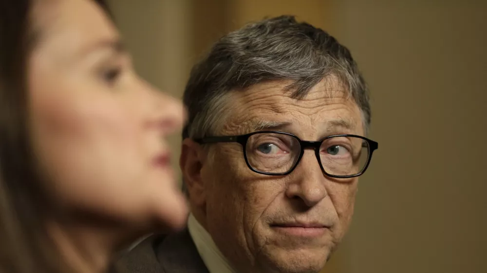 Bill Gates listens to his wife Melinda Gates during an interview in New York, Wednesday, Jan. 21, 2015. As the world decides on the most crucial goals for the next 15 years in defeating poverty, disease and hunger, the $42 billion Gates Foundation announces its own ambitious agenda. (AP Photo/Seth Wenig)
