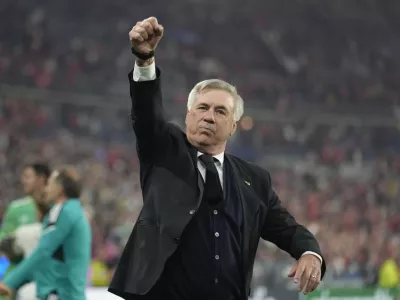 Real Madrid's head coach Carlo Ancelotti celebrates winning the Champions League final soccer match between Liverpool and Real Madrid at the Stade de France in Saint Denis near Paris, Saturday, May 28, 2022. Real Madrid won 1-0. (AP Photo/Kirsty Wigglesworth)