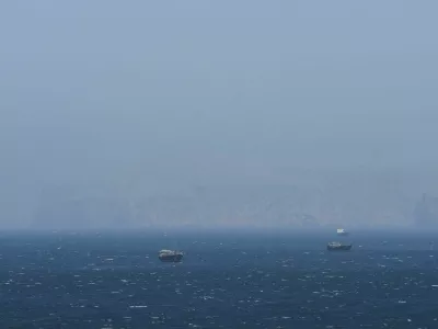 Vessels are off the coast of Musandam governorate, overlooking the strait of Hrmuz, in Musandam governance, in Oman, April 8, 2026.REUTERS/Stringer