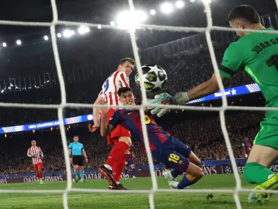 Soccer Football - UEFA Champions League - Quarter Final - First Leg - FC Barcelona v Atletico Madrid - Spotify Camp Nou, Barcelona, Spain - April 8, 2026 Atletico Madrid's Alexander Sorloth scores their second goal past FC Barcelona's Joan Garcia REUTERS/Albert Gea