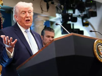 FILE PHOTO: U.S. President Donald Trump, flanked by Secretary of Defense Pete Hegseth, speaks during a press conference in the James S. Brady Press Briefing Room at the White House in Washington, D.C., U.S., April 6, 2026. REUTERS/Kevin Lamarque/File Photo