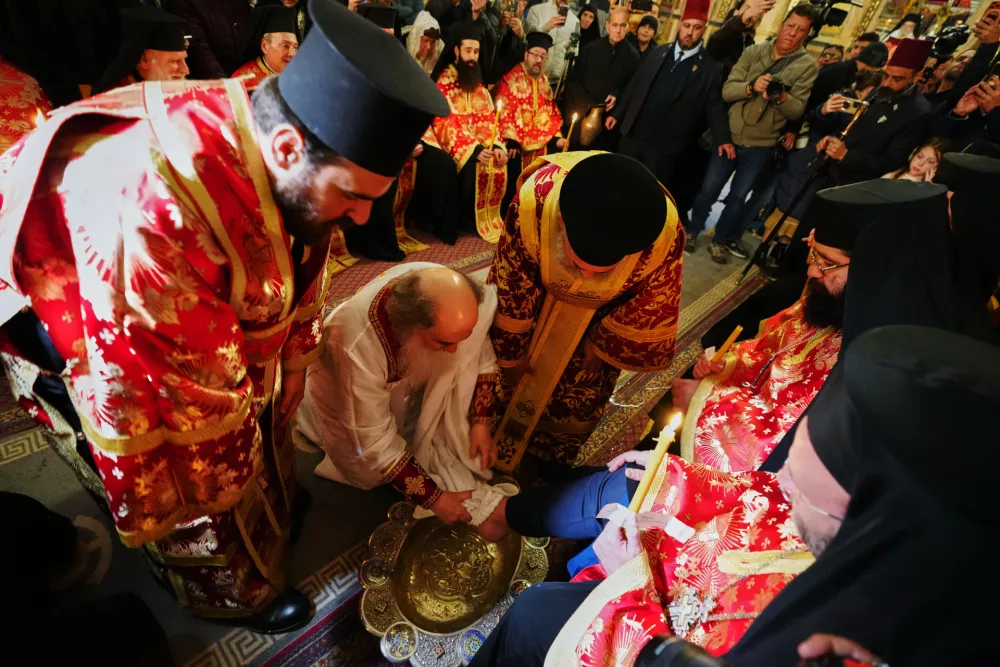 Patriarch Theophilos III, the Greek Orthodox Patriarch of Jerusalem, center left, performs the Washing of the Feet ceremony, at the Church of the Holy Sepulcher, after restrictions were lifted following a ceasefire reached between Iran, Israel and the United States, in Jerusalem's Old City, Thursday, April 9, 2026. (AP Photo/Mahmoud Illean)