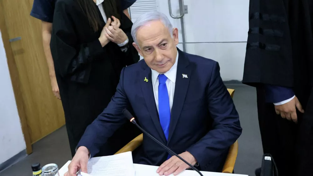 FILE PHOTO: Israeli Prime Minister Benjamin Netanyahu attends his trial on corruption charges at the district court in Tel Aviv, Israel, 21 April, 2025.  Moti Kimchi/Pool via REUTERS/File Photo