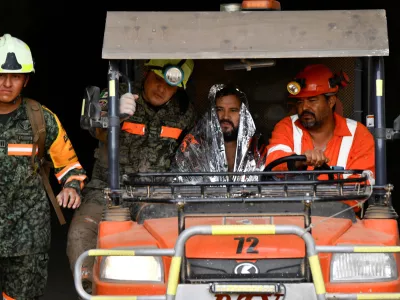 Members of rescue teams transport miner Francisco Zapata Najera, 42, after he was rescued during a search for four miners following a collapse at the Minerales de Sinaloa mine, in the municipality of El Rosario, Sinaloa state, Mexico, April 8, 2026. REUTERS/Stringer