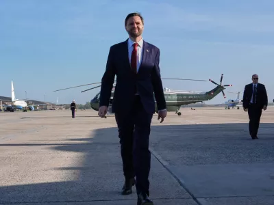 Vice President JD Vance walks to speak with the Press before boarding Air Force Two, Friday, April 10, 2026, at Joint Base Andrews, Md., for expected departure to Pakistan, for talks on Iran. (AP Photo/Jacquelyn Martin, pool)