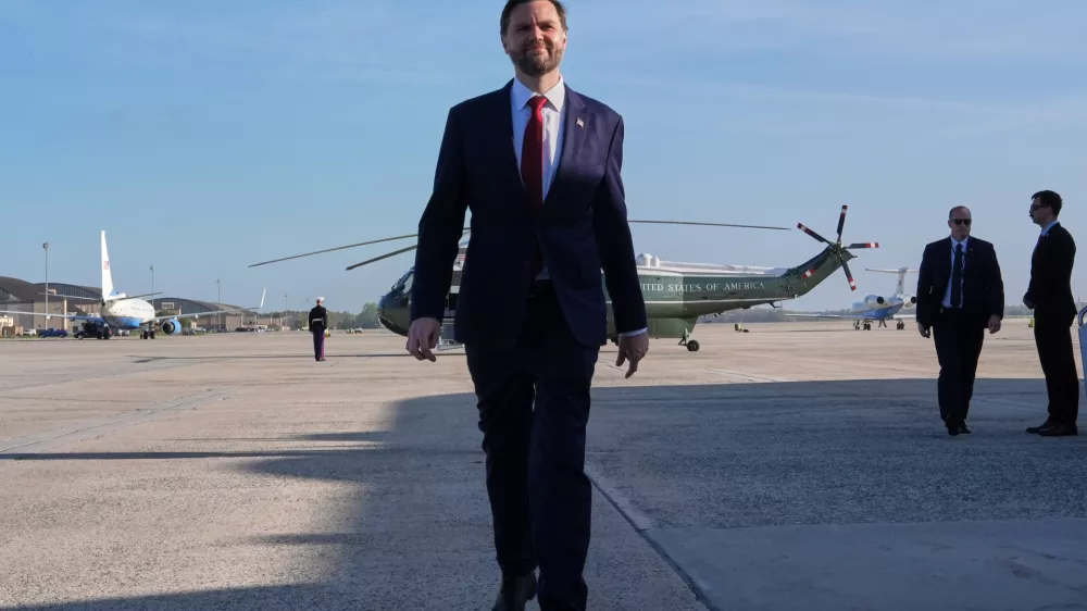Vice President JD Vance walks to speak with the Press before boarding Air Force Two, Friday, April 10, 2026, at Joint Base Andrews, Md., for expected departure to Pakistan, for talks on Iran. (AP Photo/Jacquelyn Martin, pool)