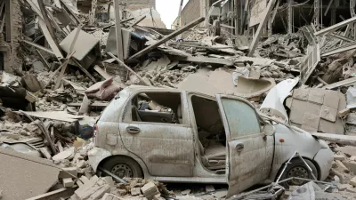 FILE PHOTO: A destroyed vehicle amid rubble at the site of a strike on a residential building, amid the U.S.-Israeli conflict with Iran, in Tehran, Iran, March 16, 2026. Majid Asgaripour/WANA (West Asia News Agency) via REUTERS ATTENTION EDITORS - THIS PICTURE WAS PROVIDED BY A THIRD PARTY/File Photo