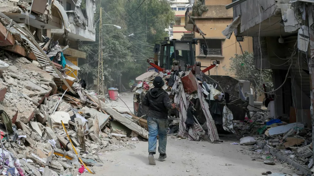 FILE PHOTO: A bulldozer works at the site of last wednesday's Israeli strike, in Tyre, Lebanon, April 10, 2026. REUTERS/Louisa Gouliamaki/File Photo