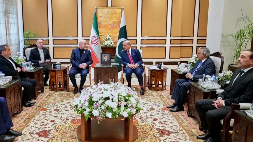 In this photo released by the Pakistan Prime Minister Office, visiting Iranian delegation headed by Iran's Parliament Speaker Mohammad Bagher Ghalibaf, third left, meet with Pakistani Prime Minister Shehbaz Sharif, in Islamabad, Pakistan, Saturday, April 11, 2026 (Pakistan Prime Minister Office via AP)