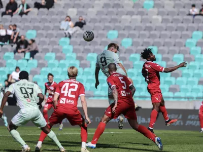 Dino Kojič, Eric Taylor- 11.04.2026 - nogomet - 29. krog 1. SNL med Olimpija: Aluminij//FOTO: Jaka Gasar