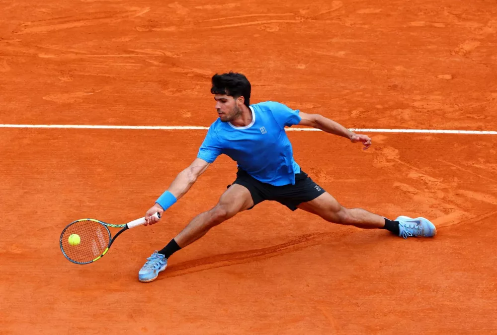 Tennis - ATP Masters 1000 - Monte Carlo Masters - Monte Carlo Country Club, Roquebrune-Cap-Martin, France - April 12, 2026 Spain's Carlos Alcaraz in action during his final match against Italy's Jannik Sinner REUTERS/Manon Cruz
