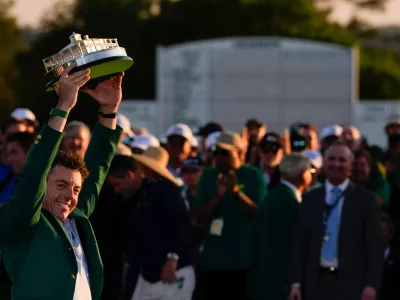 Rory McIlroy, of Northern Ireland, holds the trophy after winning the Masters golf tournament at the Augusta National Golf Club, Sunday, April 12, 2026, in Augusta, Ga.(AP Photo/Matt Slocum)