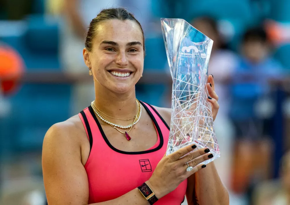Mar 28, 2026; Miami Gardens, FL, USA; Aryna Sabalenka of Belarus poses with the Butch Buchholz Championship trophy after defeating Coco Gauff of the United States in the final of the women's singles at the Hard Rock Stadium. Mandatory Credit: Mike Frey-Imagn Images   TPX IMAGES OF THE DAY