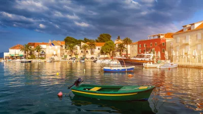 Fishing boat anchoring in beautiful Sutivan port, Brac island, Croatia. Sutivan on Island Brac in Croatia. Made of well known white limestone. Port with fishing boats. Sutivan, Brac, Croatia.