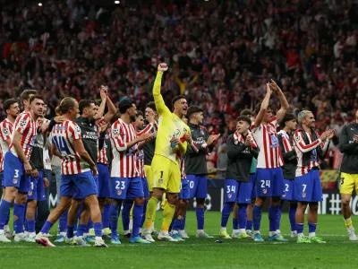 Soccer Football - UEFA Champions League - Quarter Final - Second Leg - Atletico Madrid v FC Barcelona - Riyadh Air Metropolitano, Madrid, Spain - April 14, 2026 Atletico Madrid players celebrate after the match REUTERS/Gonzalo Fuentes
