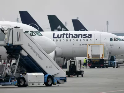 Lufthansa aircraft are parked at an airport as Lufthansa pilots are on a two-day strike in Munich, Germany, Monday, April 13, 2026. (AP Photo/Matthias Schrader)
