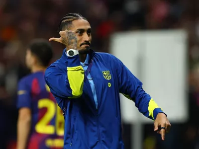 Soccer Football - UEFA Champions League - Quarter Final - Second Leg - Atletico Madrid v FC Barcelona - Riyadh Air Metropolitano, Madrid, Spain - April 14, 2026 FC Barcelona's Raphinha looks dejected after the match REUTERS/Albert Gea