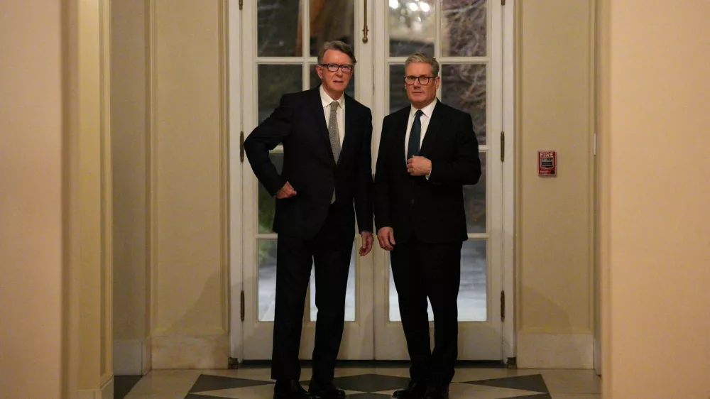 FILE PHOTO: British Prime Minister Keir Starmer talks with Britain's ambassador to the United States Peter Mandelson during a welcome reception at the ambassador's residence on February 26, 2025, in Washington, DC, U.S. Carl Court/Pool via REUTERS/File Photo
