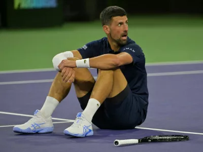 FILE PHOTO: Mar 11, 2026; Indian Wells, CA, USA; Novak Djokovic (SRB) takes a moment on the court after a long rally during his fourth round match against Jack Draper (GBR) in the BNP Paribas Open at the Indian Wells Tennis Garden. Mandatory Credit: Jayne Kamin-Oncea-Imagn Images/File Photo