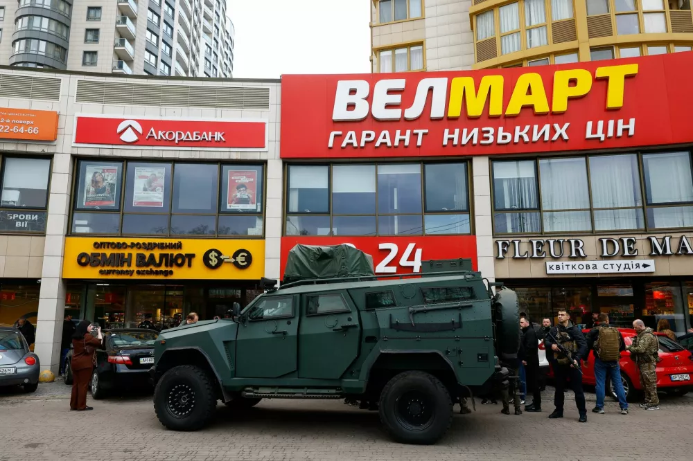 An armoured vehicle outisde a supermarket, where Ukrainian police killed a man who opened fire in a city district and barricaded himself into the supermarket on Saturday, Ukrainian Interior Minister Ihor Klymenko said, in Kyiv, Ukraine, April 18, 2026. REUTERS/Valentyn Ogirenko