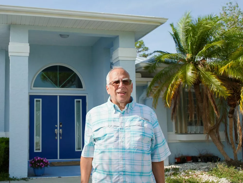 Louis "Lou" Prevost, eldest brother of Pope Leo XIV, poses for a portrait outside his home in Port Charlotte, Florida, U.S., May 9, 2025. REUTERS/Maria Alejandra Cardona