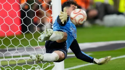 Real Sociedad's goalkeeper Unai Marrero makes a save during during the penalty shoot out at the Copa del Rey final soccer match between Atletico Madrid and Real Sociedad in Seville, Spain, Saturday, April. 18, 2026. (AP Photo/Jose Breton)