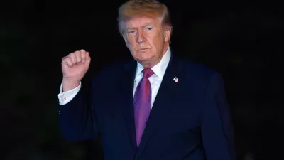 President Donald Trump waves to reporters as he walks on the South Lawn upon his arrival to the White House, Friday, April 17, 2026, in Washington. (AP Photo/Jose Luis Magana)