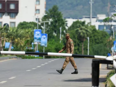 A Pakistani army soldier walks on the premises of the Serena Hotel, as Pakistan prepares to host the U.S. and Iran for the second phase of peace talks in Islamabad, Pakistan, April 21, 2026. REUTERS/Akhtar Soomro