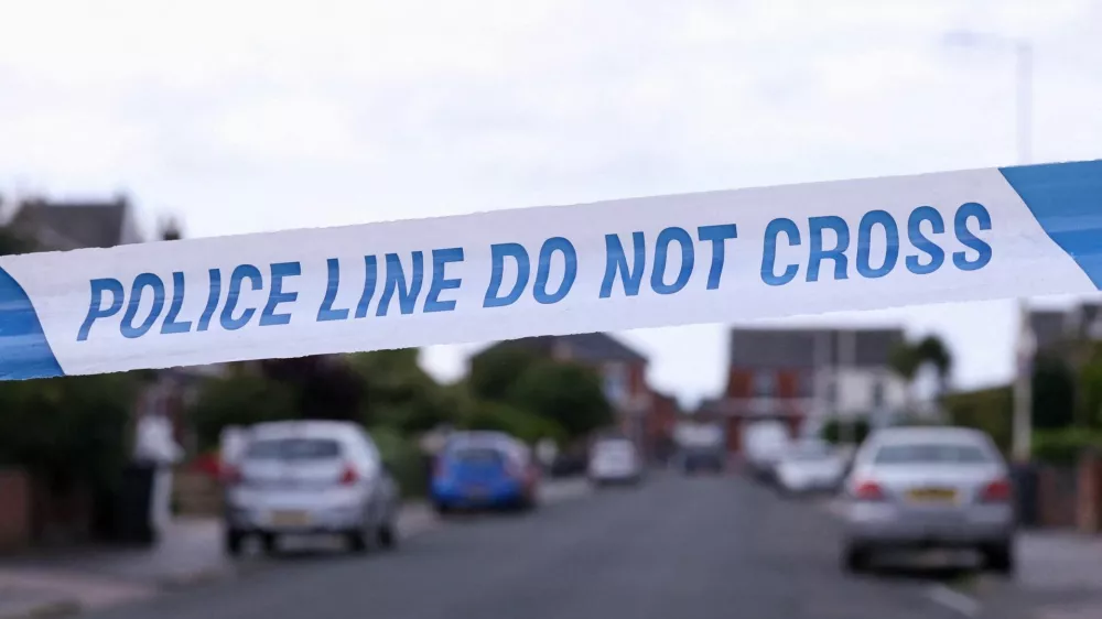 FILE PHOTO: Police tape outlines a perimeter, in Maple street, near a tribute for the victims of a knife attack in Southport, Britain, August 2, 2024. REUTERS/Manon Cruz/File Photo
