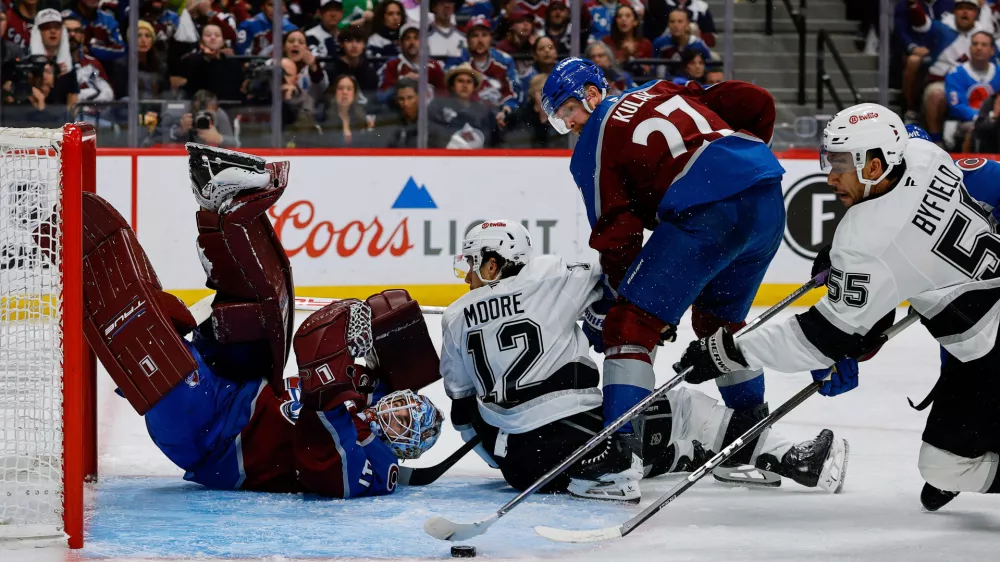 Apr 21, 2026; Denver, Colorado, USA; Colorado Avalanche goaltender Scott Wedgewood (41) watches as Los Angeles Kings right wing Quinton Byfield (55) is unable to control the puck as left wing Trevor Moore (12) and defenseman Brett Kulak (27) defend in the third period in game two of the first round of the 2026 Stanley Cup Playoffs at Ball Arena. Mandatory Credit: Isaiah J. Downing-Imagn Images